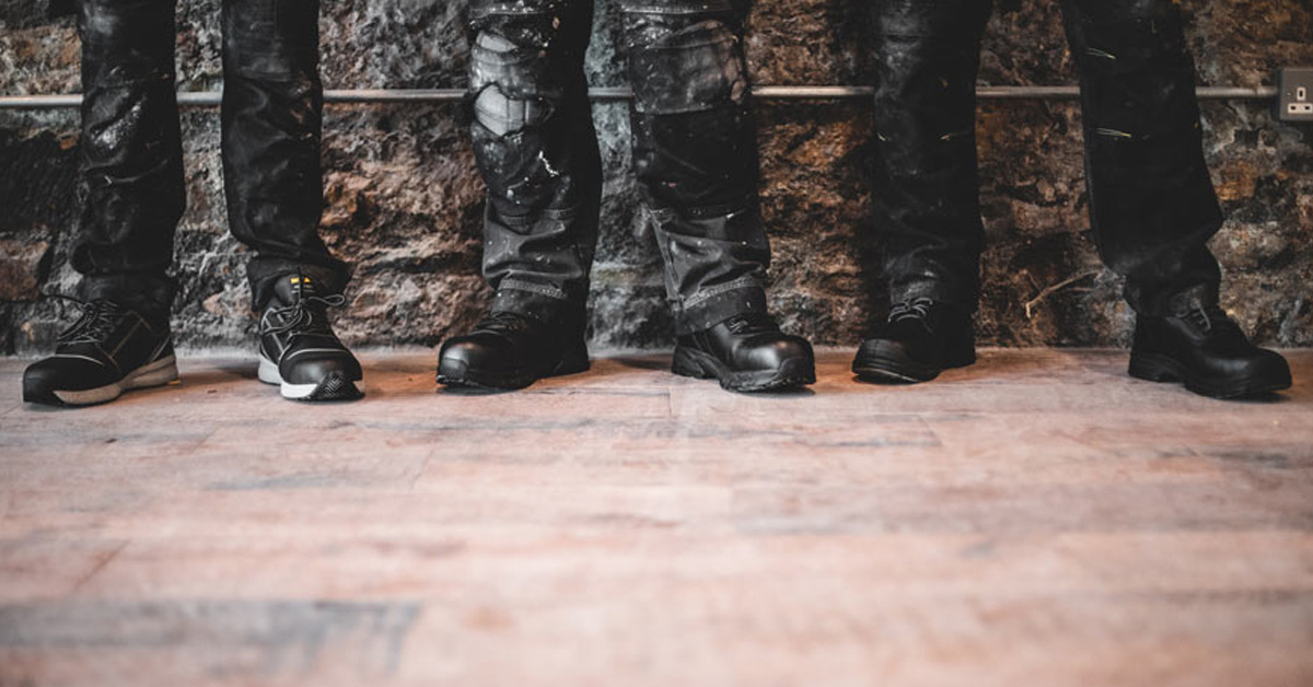 Three workers wearing Shoes For Crews safety styles with slip-resistant rubber outsoles