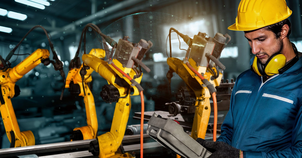 Manufacturing employee working with machinery wearing protective workwear