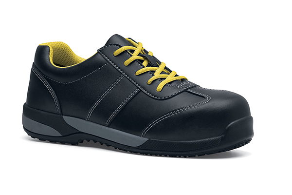 Black Clyde shoe with yellow laces and waterproof, sustainably made uppers